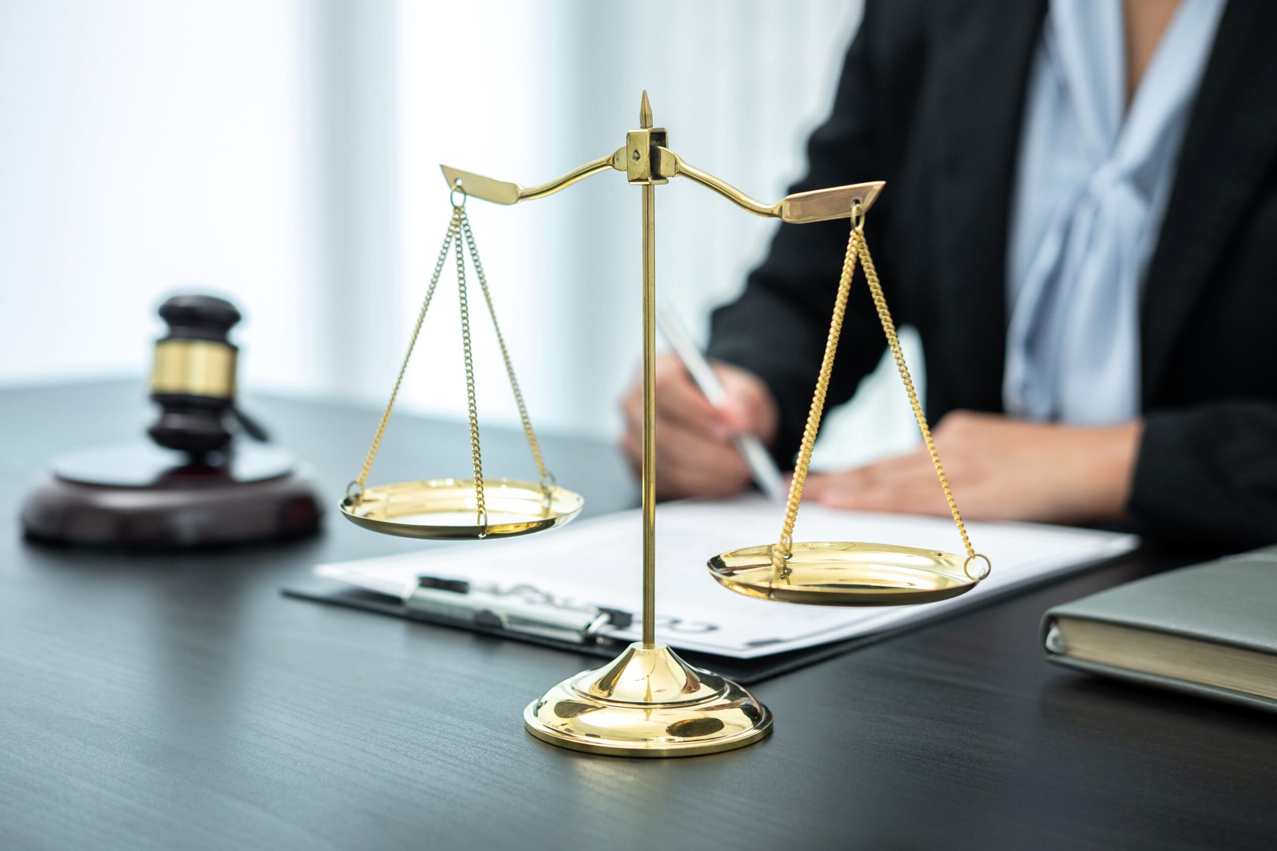 female-lawyer-working-with-legal-case-document-con-2023-11-27-05-29-00-utc-scaled-min