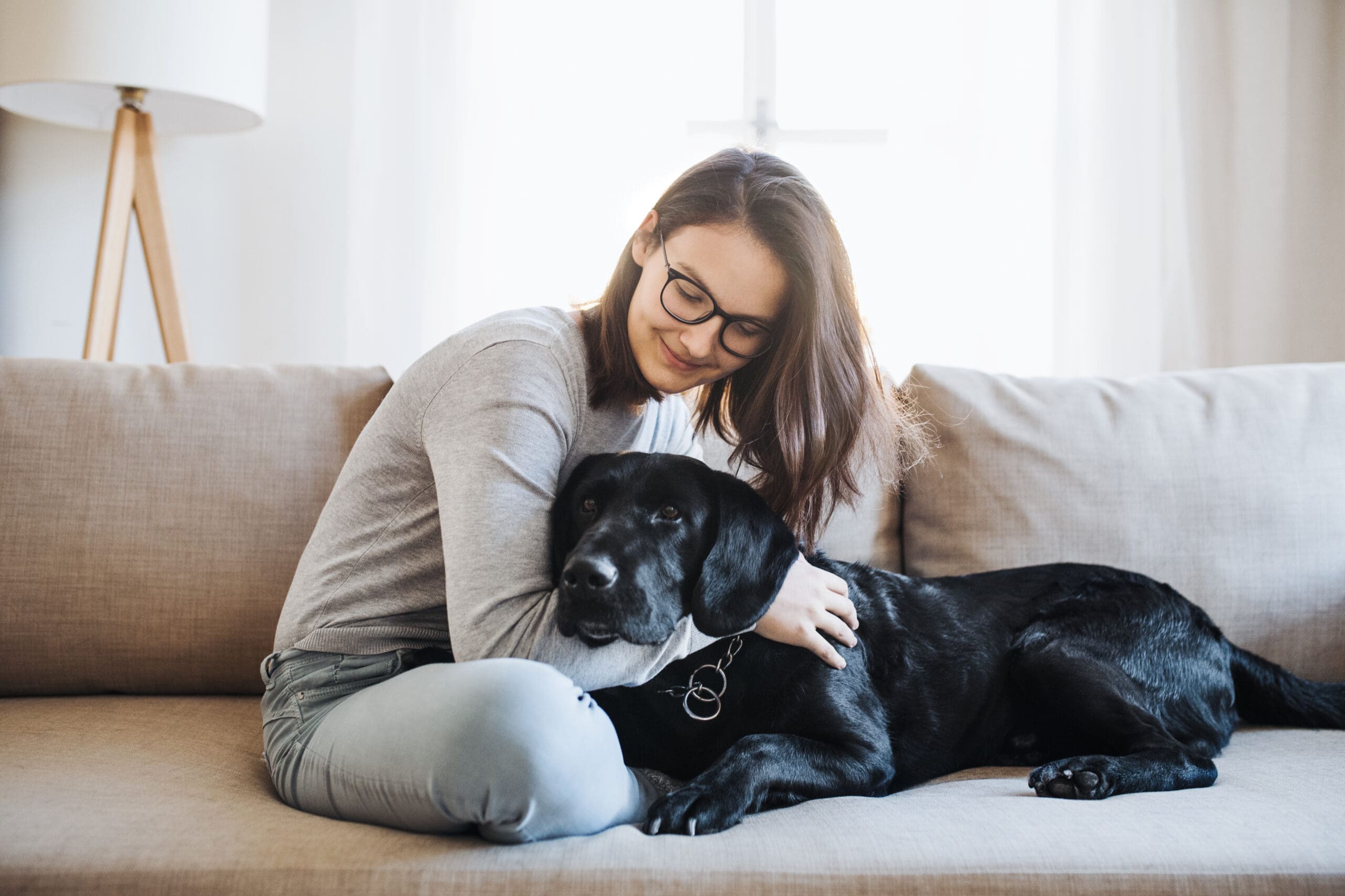 teenage-girl-sitting-on-a-sofa-indoors-playing-wi-2023-11-27-05-23-28-utc-scaled-min